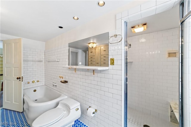 full bath with a stall shower, a soaking tub, tile walls, and toilet