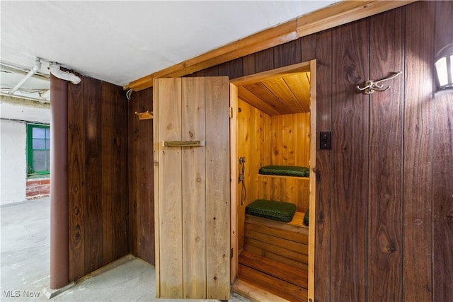 interior space featuring wood walls