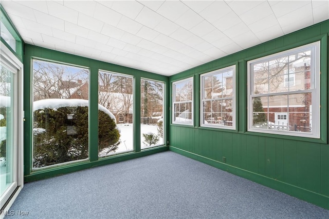 unfurnished sunroom featuring plenty of natural light