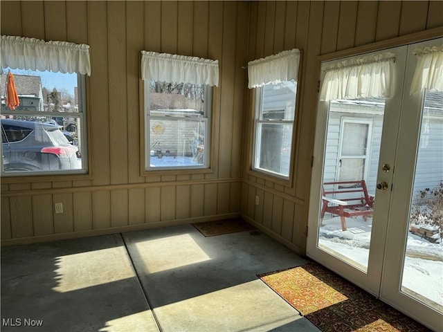 unfurnished sunroom featuring french doors