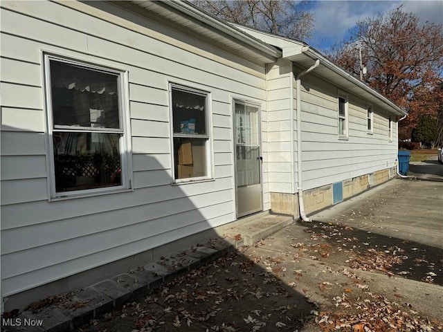 view of side of property featuring a patio