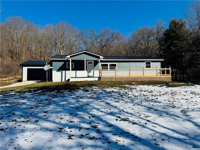 view of front of property featuring a garage and covered porch