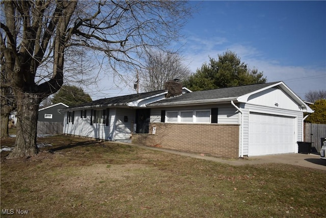 ranch-style home with a garage, brick siding, concrete driveway, a chimney, and a front yard