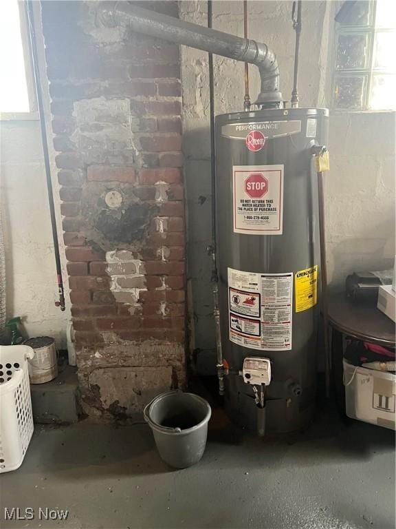 utility room featuring gas water heater