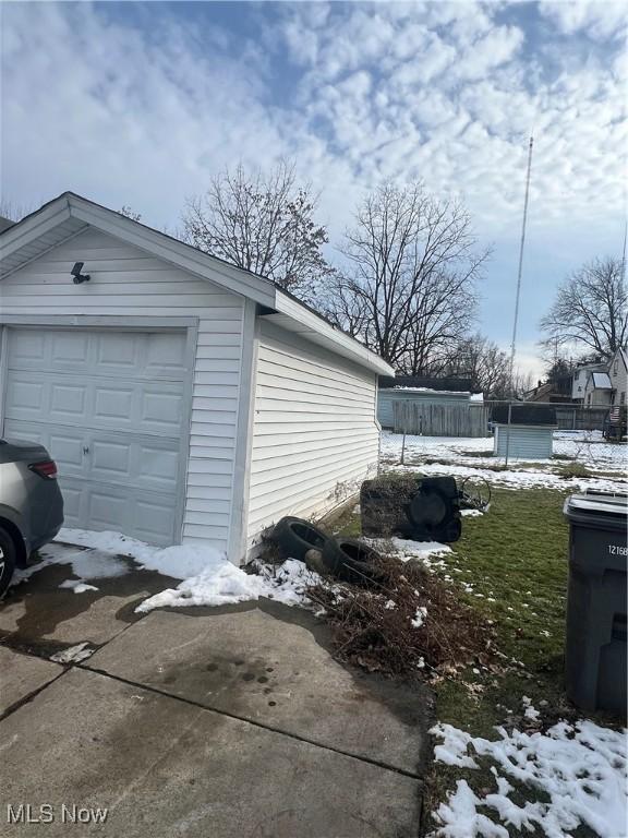 view of snow covered garage