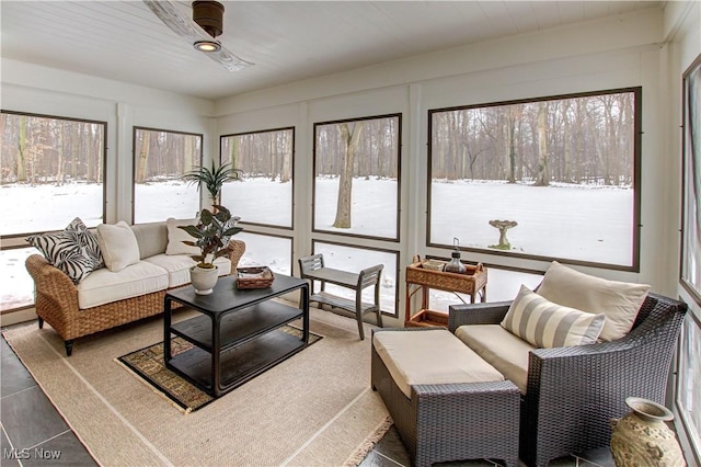 sunroom / solarium featuring a baseboard heating unit