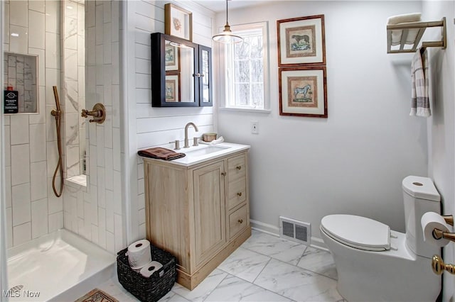 full bath with visible vents, toilet, marble finish floor, vanity, and a shower stall