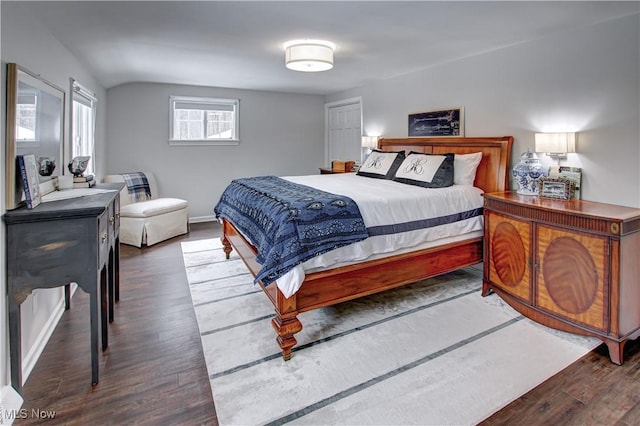 bedroom with dark wood-style floors