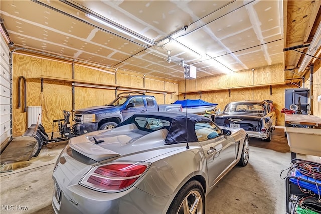 garage featuring wooden walls