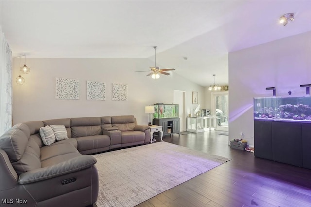 living area featuring dark wood-style floors, vaulted ceiling, and ceiling fan with notable chandelier