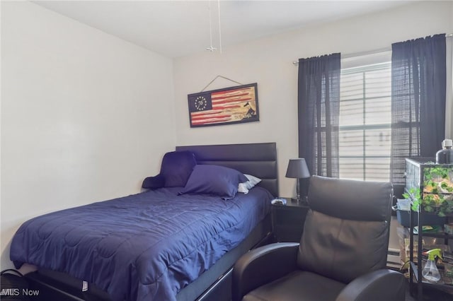 bedroom featuring baseboard heating