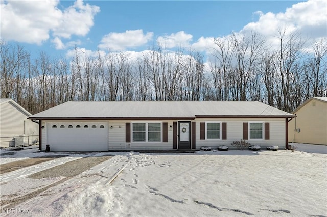 single story home featuring a garage