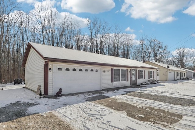 ranch-style home featuring an attached garage