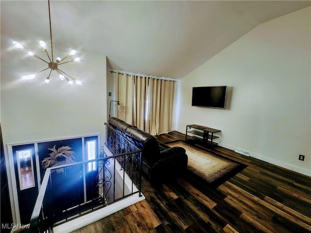 living area featuring baseboards, visible vents, wood finished floors, vaulted ceiling, and a notable chandelier