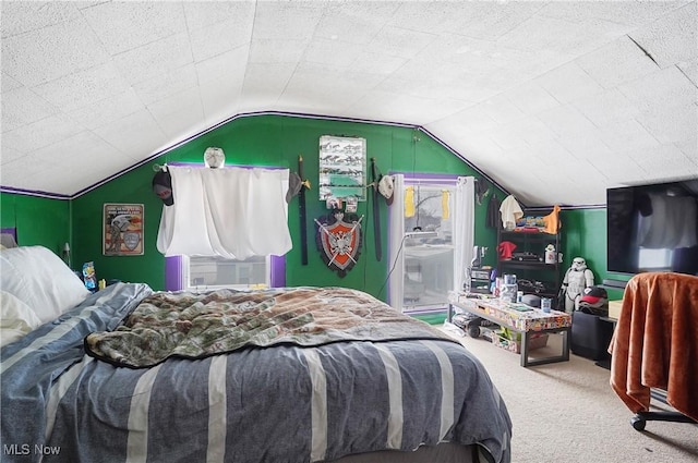 carpeted bedroom featuring lofted ceiling