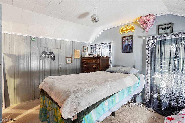 carpeted bedroom with lofted ceiling