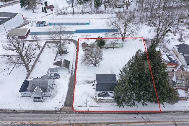 snowy aerial view featuring a residential view