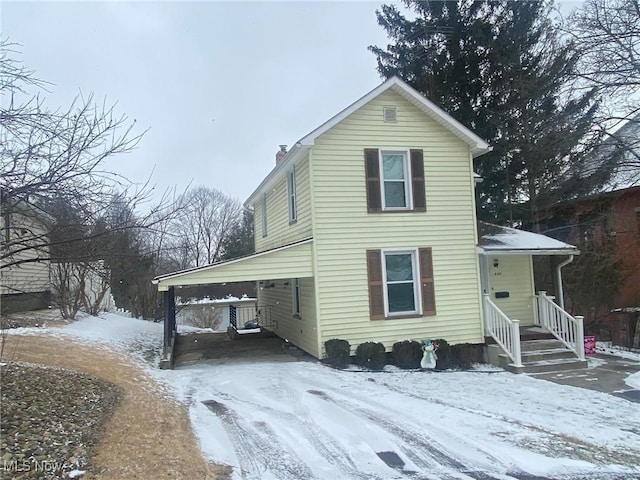 view of front of home featuring a chimney