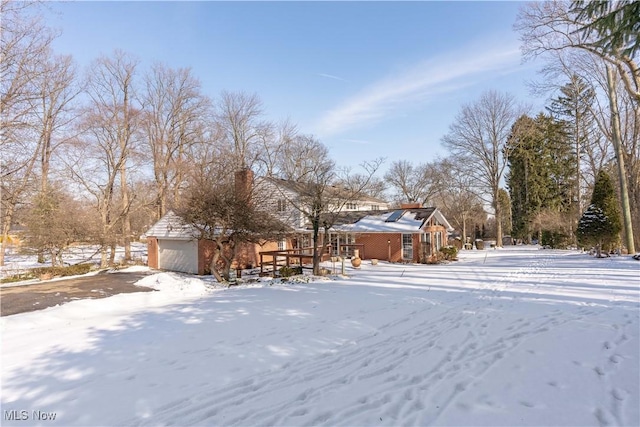 view of yard layered in snow