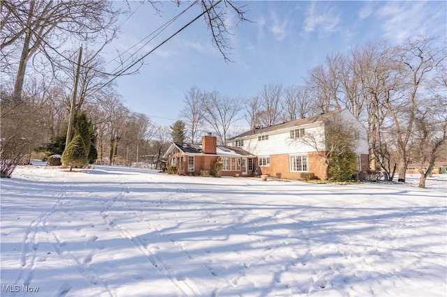 view of yard layered in snow