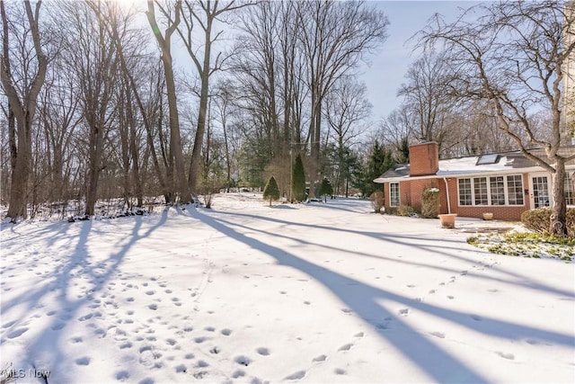 view of yard layered in snow