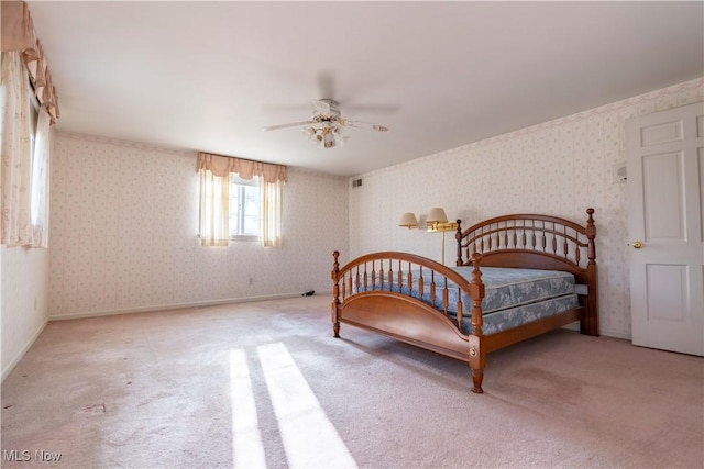 bedroom with light carpet, wallpapered walls, visible vents, and baseboards