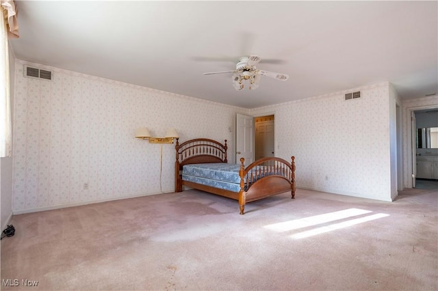 unfurnished bedroom featuring carpet, visible vents, and wallpapered walls