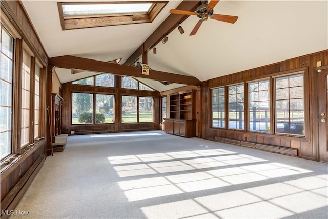 unfurnished sunroom with vaulted ceiling with beams and baseboard heating