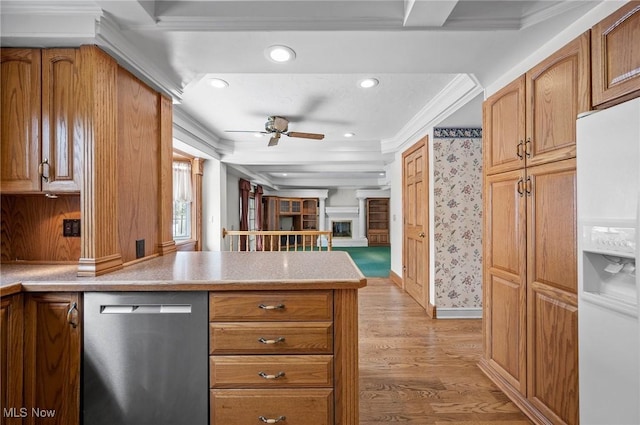 kitchen featuring white refrigerator with ice dispenser, a fireplace with raised hearth, light countertops, crown molding, and stainless steel dishwasher