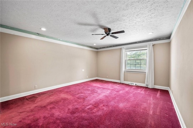 carpeted empty room with a textured ceiling, recessed lighting, a ceiling fan, baseboards, and crown molding