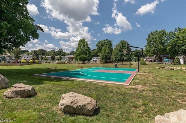 view of basketball court featuring community basketball court and a yard