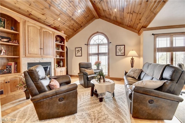 living room with plenty of natural light, a fireplace, and wood ceiling