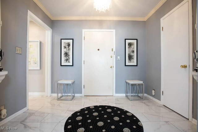 foyer entrance featuring marble finish floor, baseboards, and crown molding