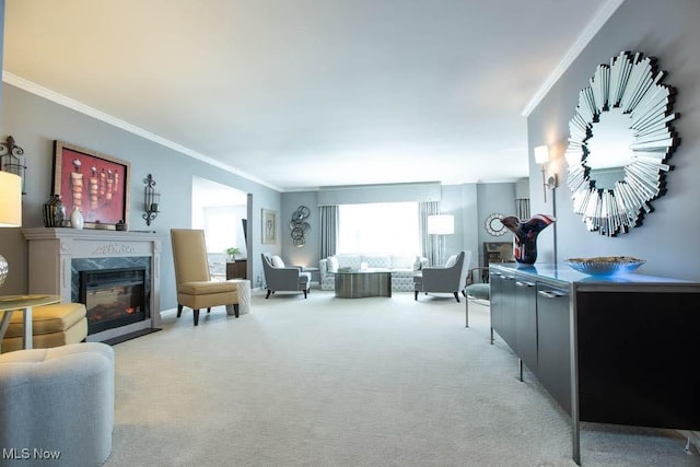 living room with light carpet, a high end fireplace, and crown molding