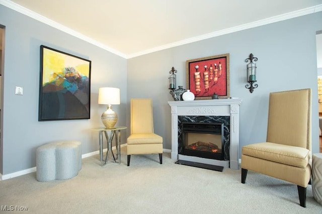 living area with carpet floors, a high end fireplace, crown molding, and baseboards