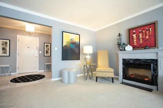 living area with light carpet, ornamental molding, a high end fireplace, and baseboards