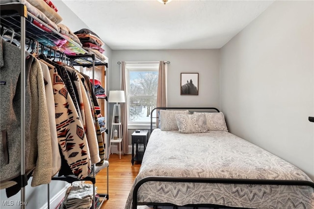 bedroom with wood finished floors