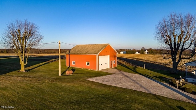 view of outbuilding featuring driveway and an outdoor structure