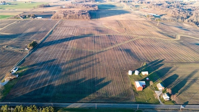 birds eye view of property with a rural view