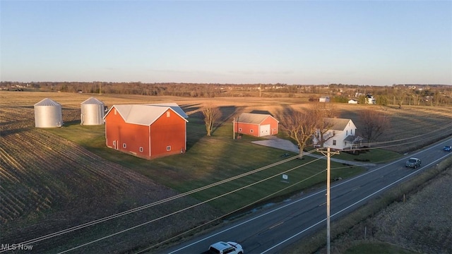 birds eye view of property with a rural view