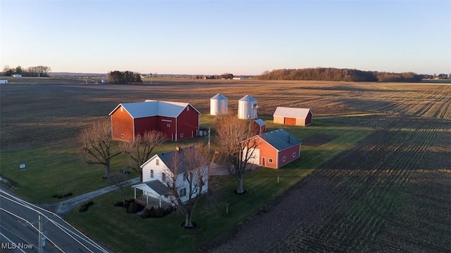 birds eye view of property with a rural view