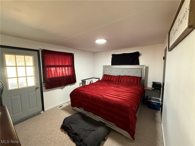 carpeted bedroom with visible vents