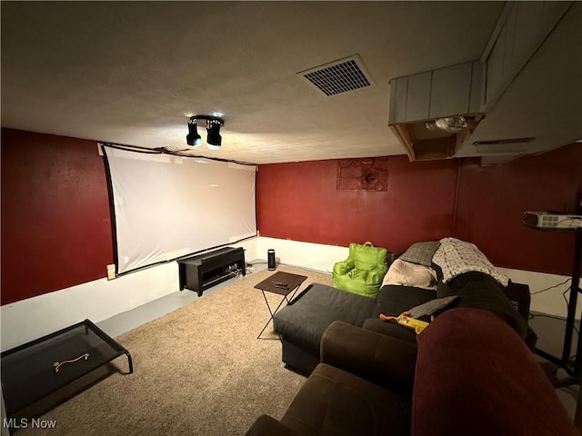 cinema room with carpet flooring and visible vents