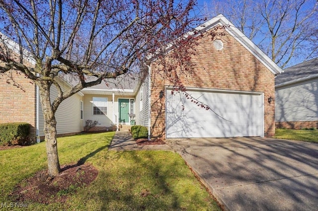 view of front of home featuring concrete driveway, a front lawn, and an attached garage