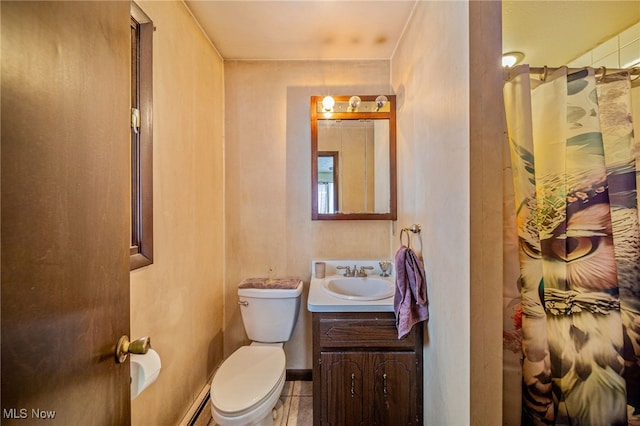 full bath with baseboards, toilet, tile patterned flooring, vanity, and a baseboard heating unit