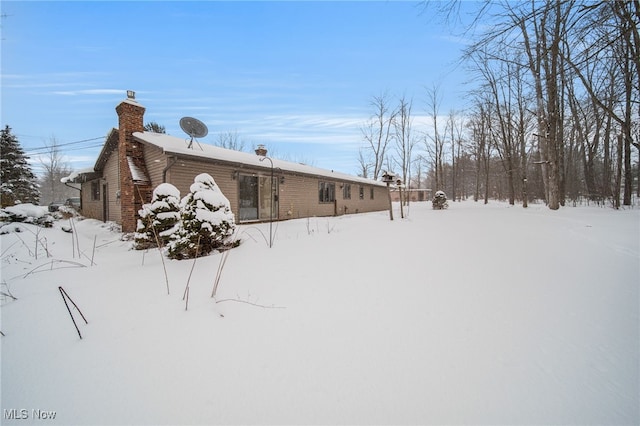 exterior space featuring a chimney