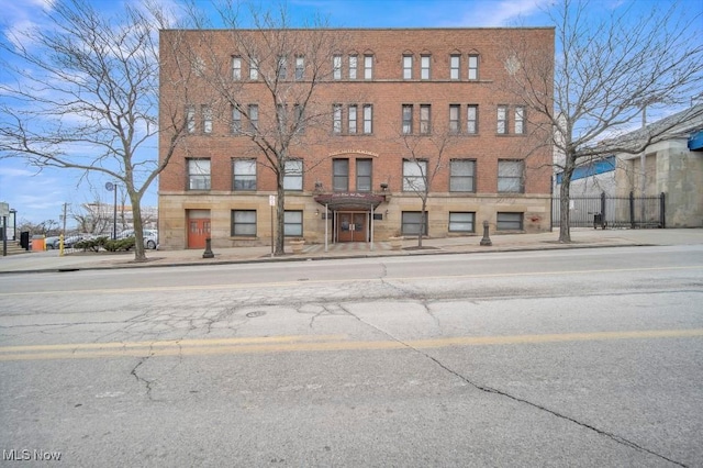 view of building exterior with fence