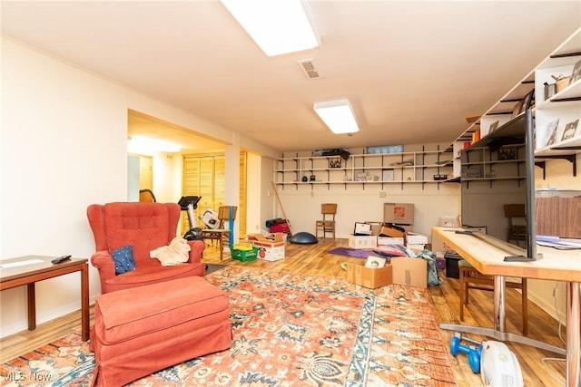 interior space featuring visible vents and wood finished floors