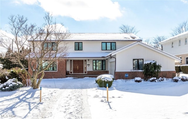 view of front of house featuring brick siding