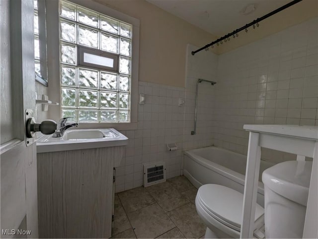 5151 Erwin St, Maple Heights, OH 44137 - full bath featuring visible vents, tile walls, tile patterned floors, vanity, and toilet